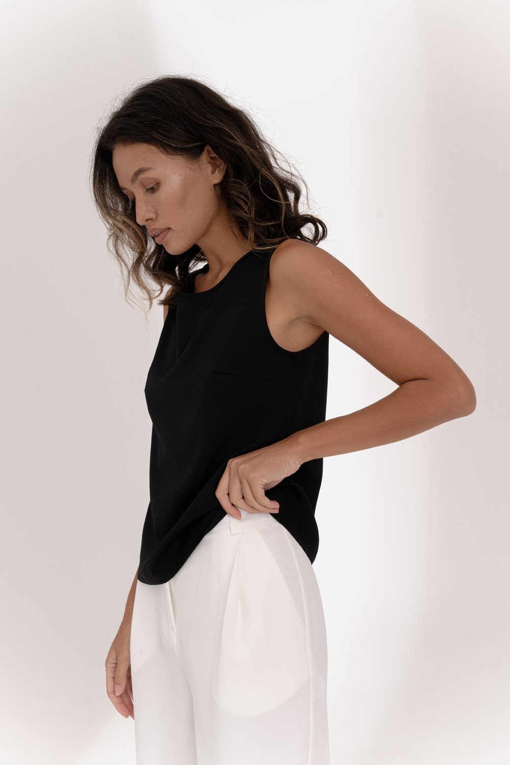 Black sleeveless top with lace insert on the back