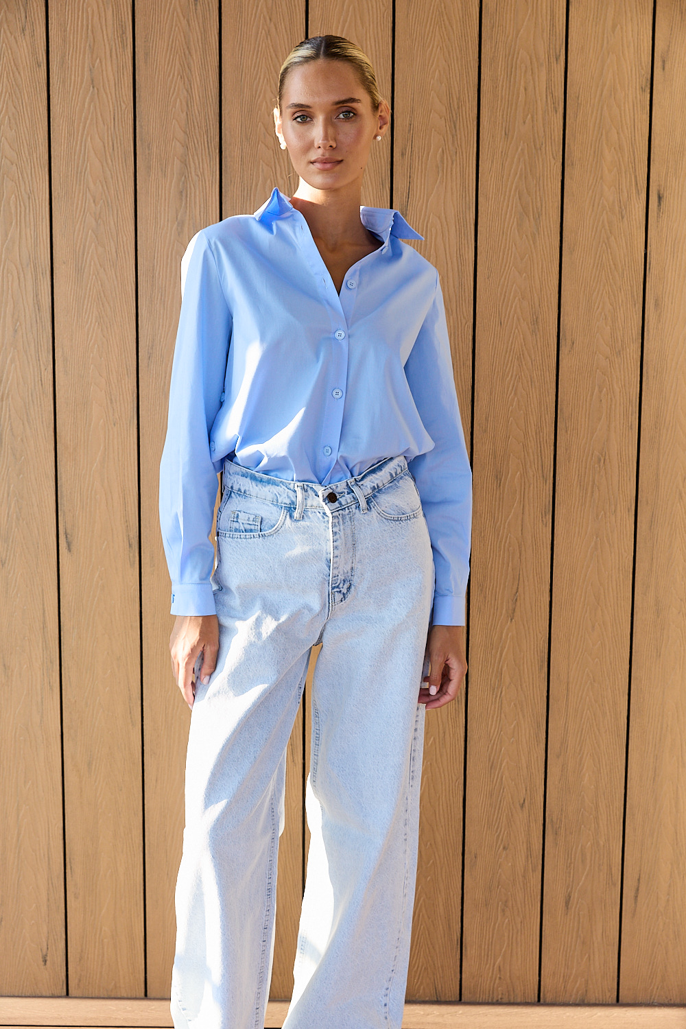 Blue cotton shirt with functional buttons on the sides