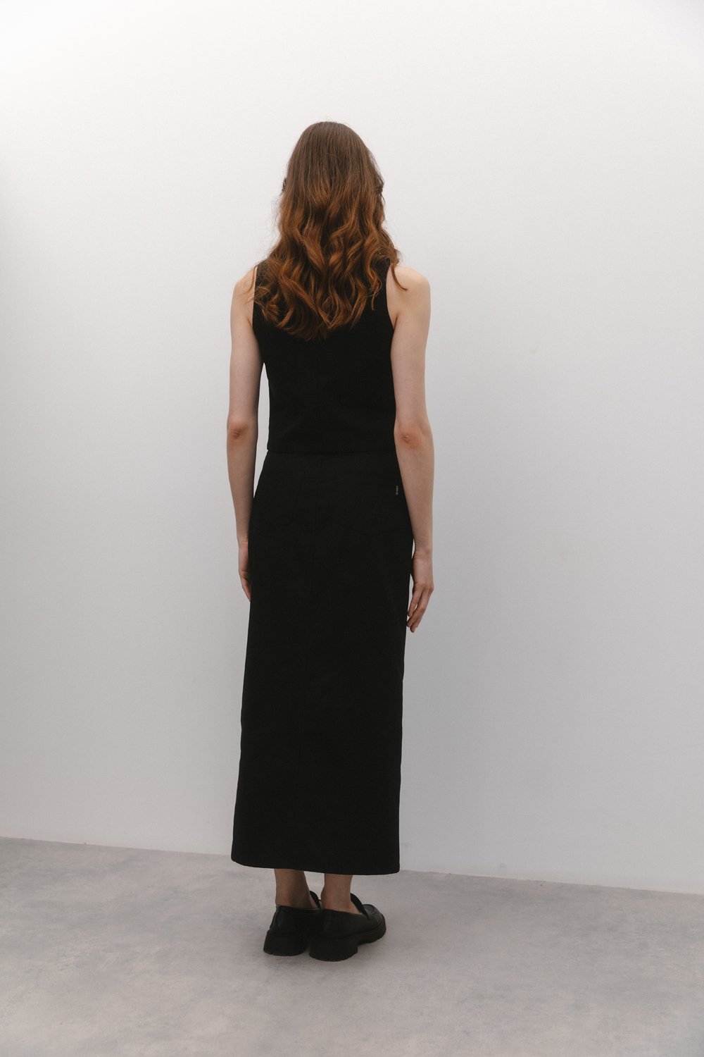 Black denim skirt with front slit