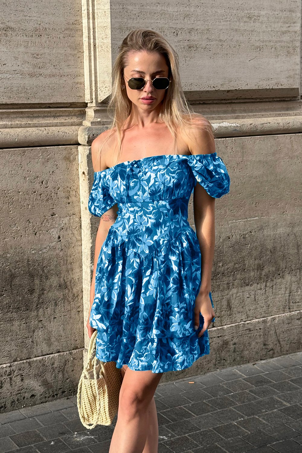 Blue dress with a full double skirt and puff sleeves