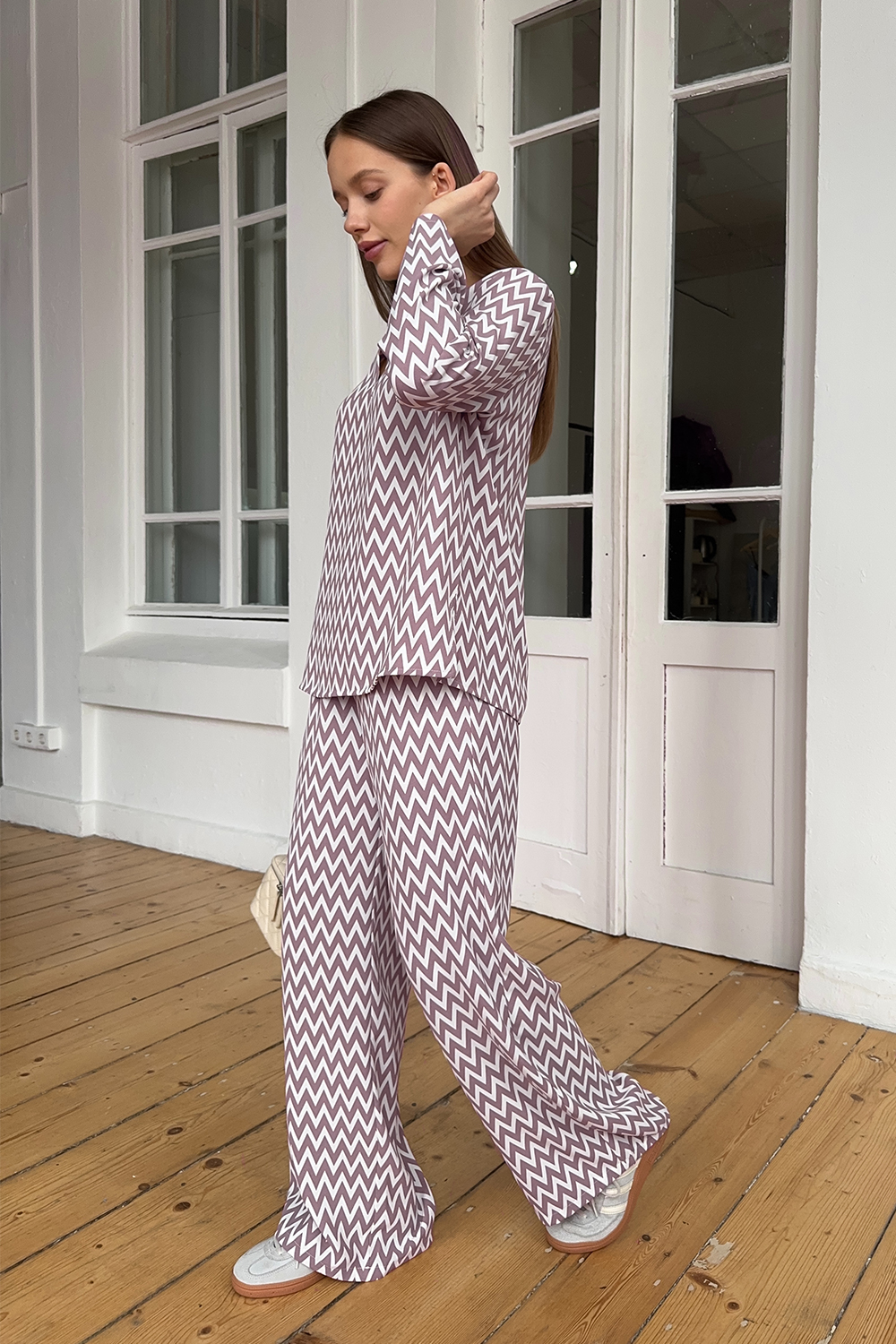 Pink trouser suit with slits and a shaped neckline