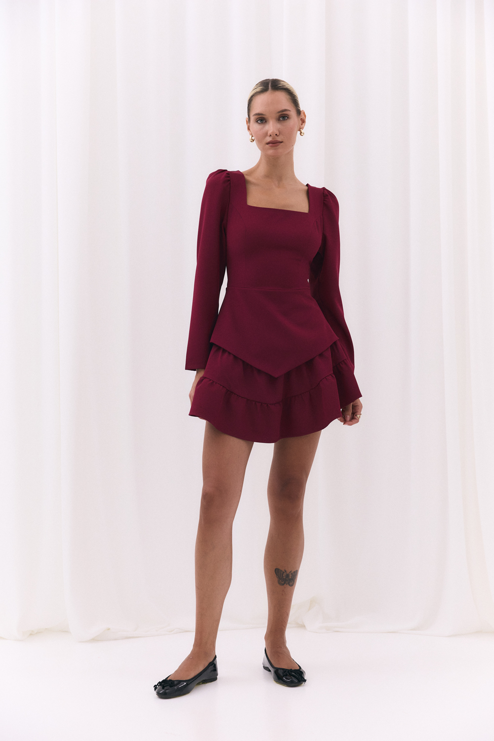 Burgundy blouse with a figured peplum