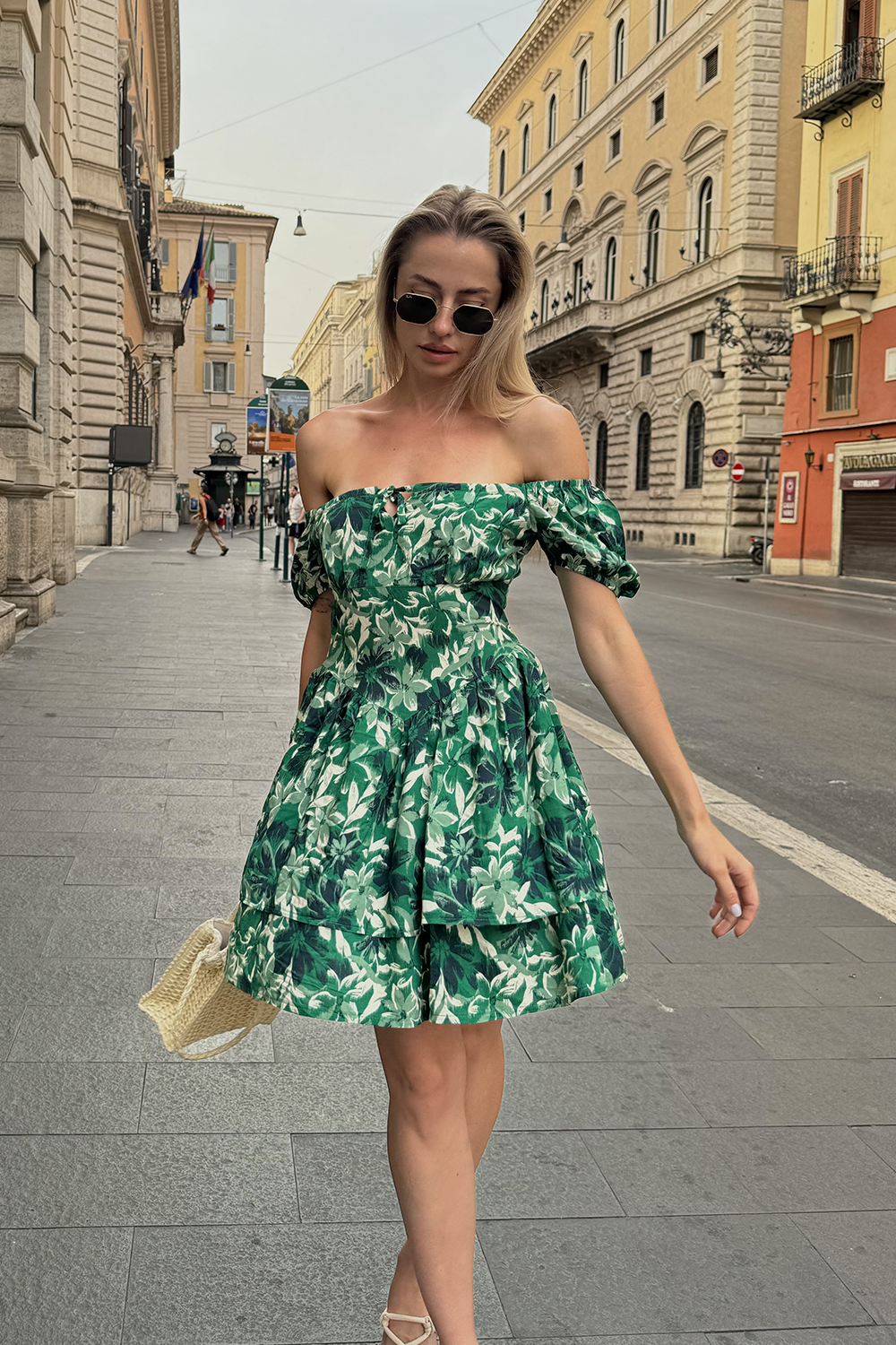 Green dress with a full double skirt and puff sleeves