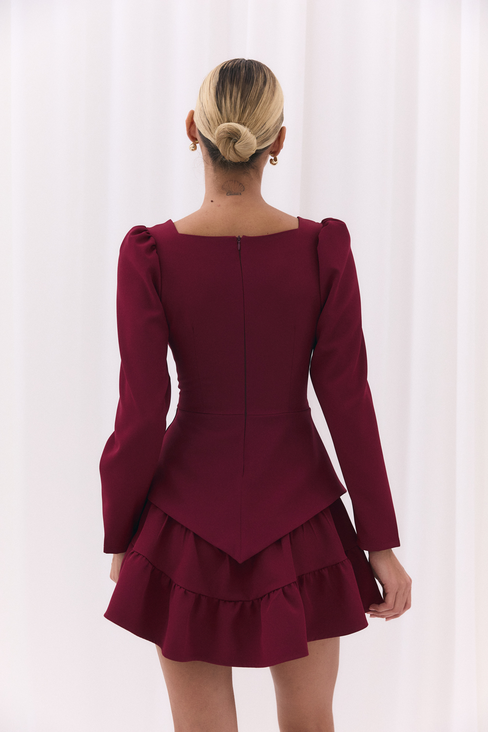 Burgundy blouse with a figured peplum