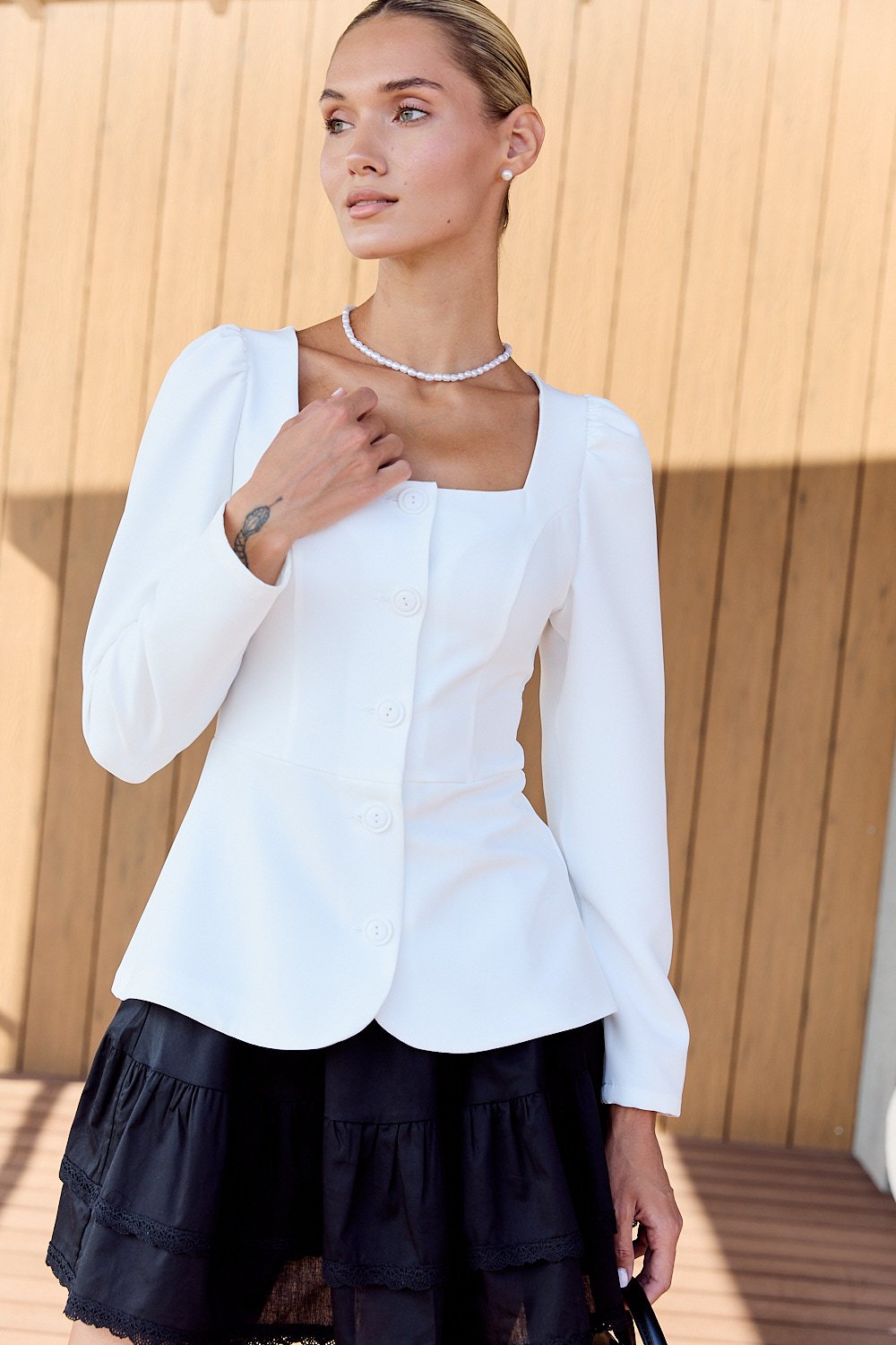 White dress with peplum and buttons