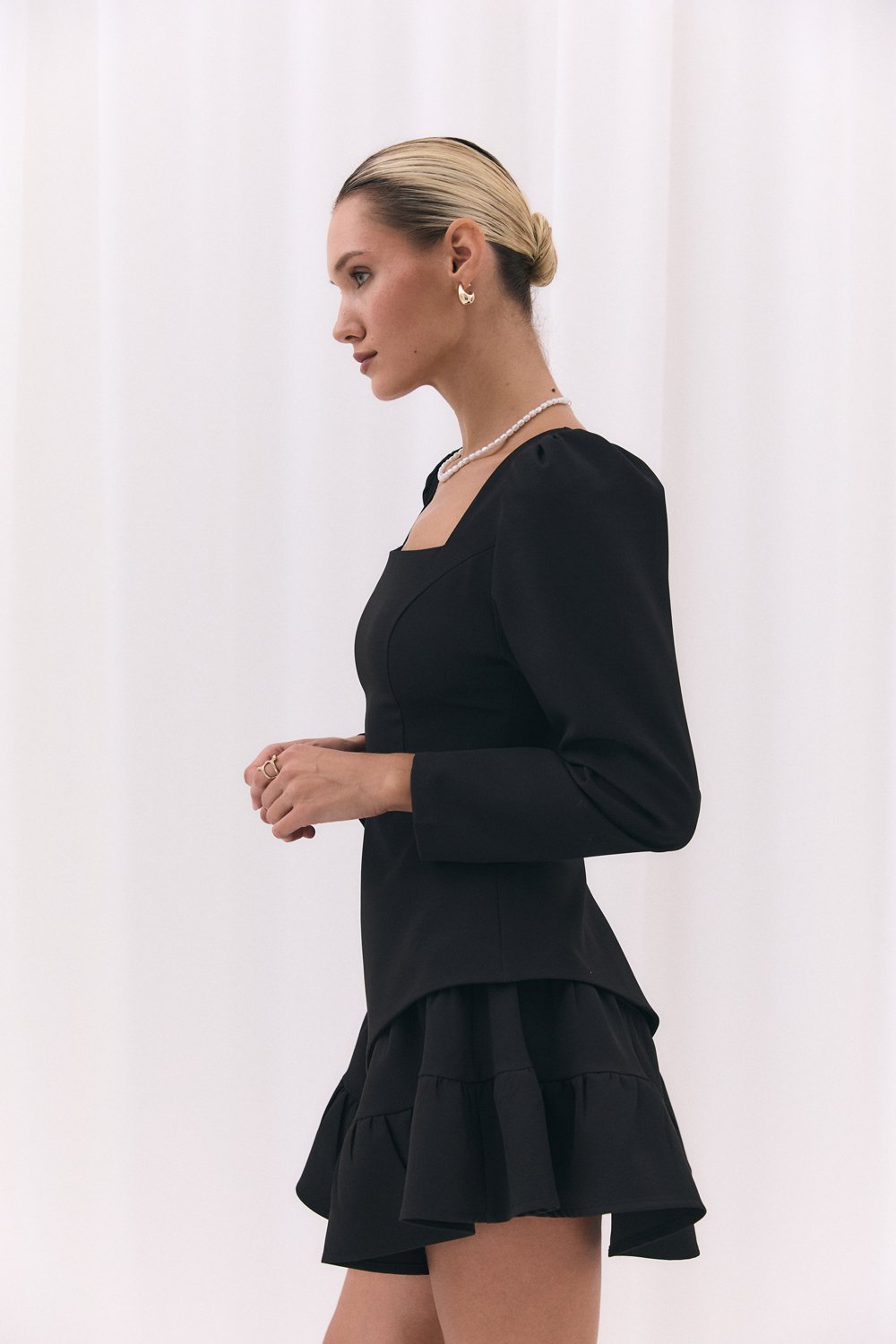 Black blouse with a figured peplum