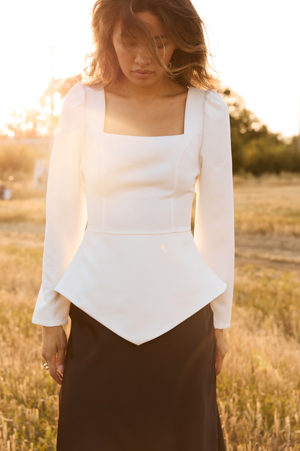 Milk blouse with a figured peplum