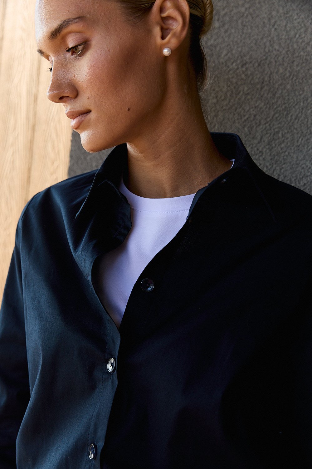 Dark blue cotton shirt with functional buttons on the sides