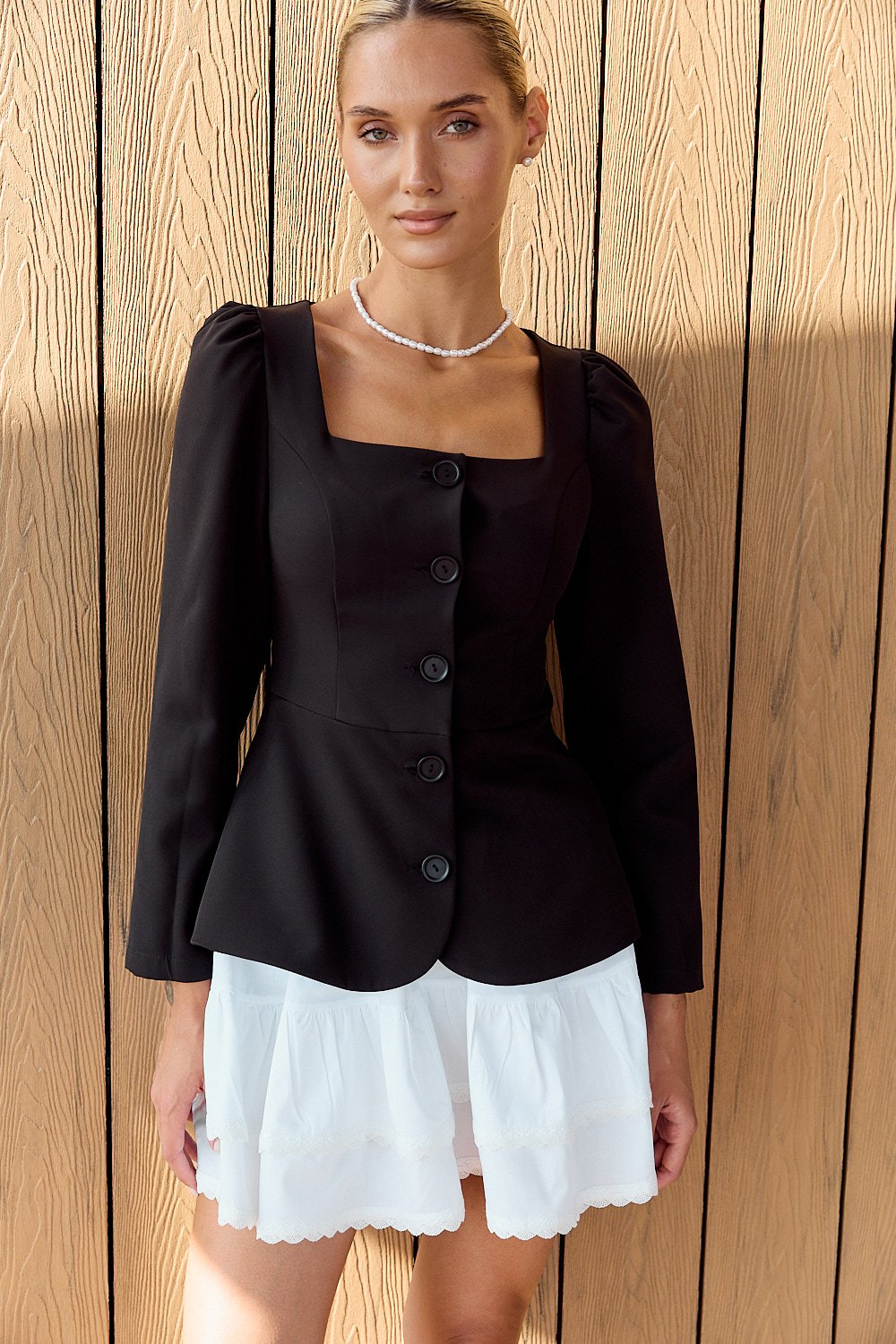 Black dress with peplum and buttons