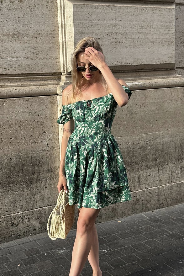 Green dress with a full double skirt and puff sleeves