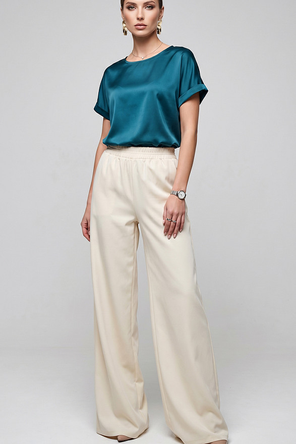 Кремові вільні жіночі штани на гумці з кишенями