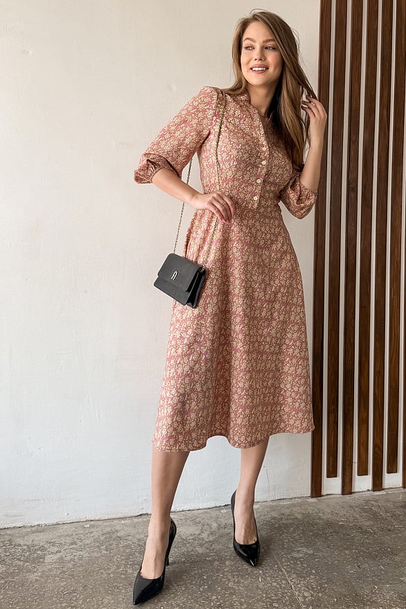 Pink fitted dress with flared skirt