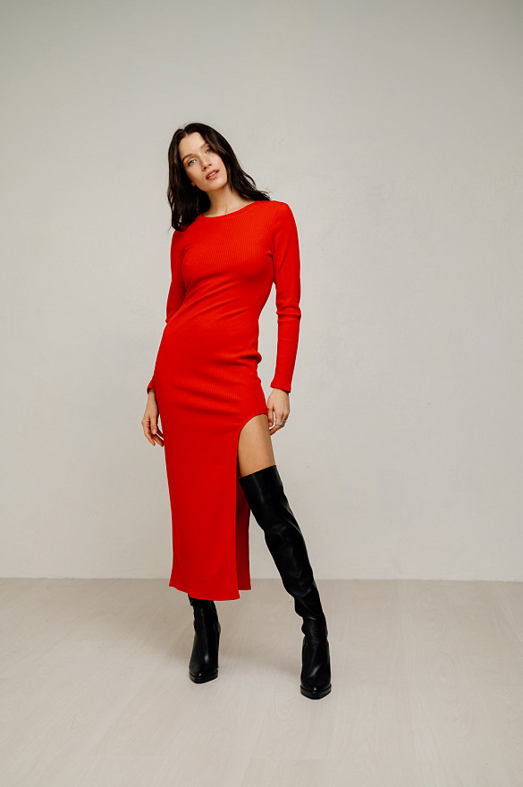 Red midi length dress with an elegant cutout on the left.