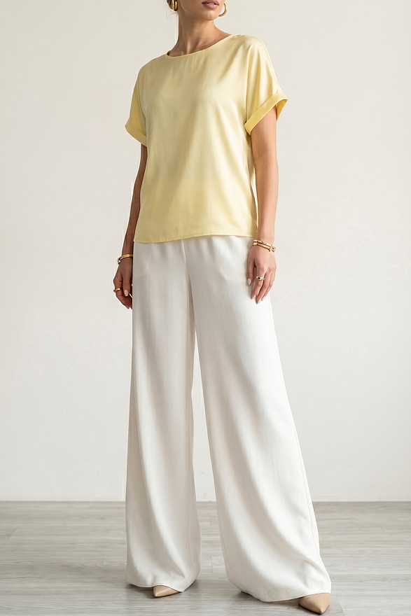 Білі вільні жіночі штани на гумці з кишенями