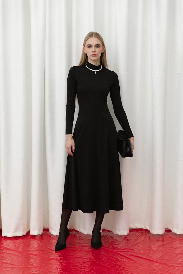 Black fitted midi dress with sophisticated flared skirt