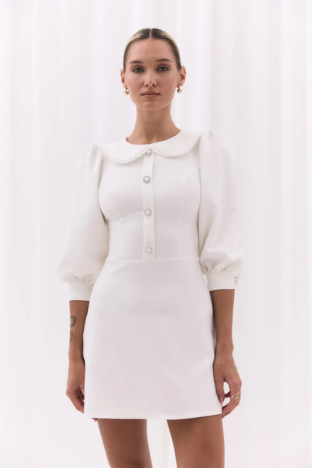 White fitted dress with a-line skirt and lace collar