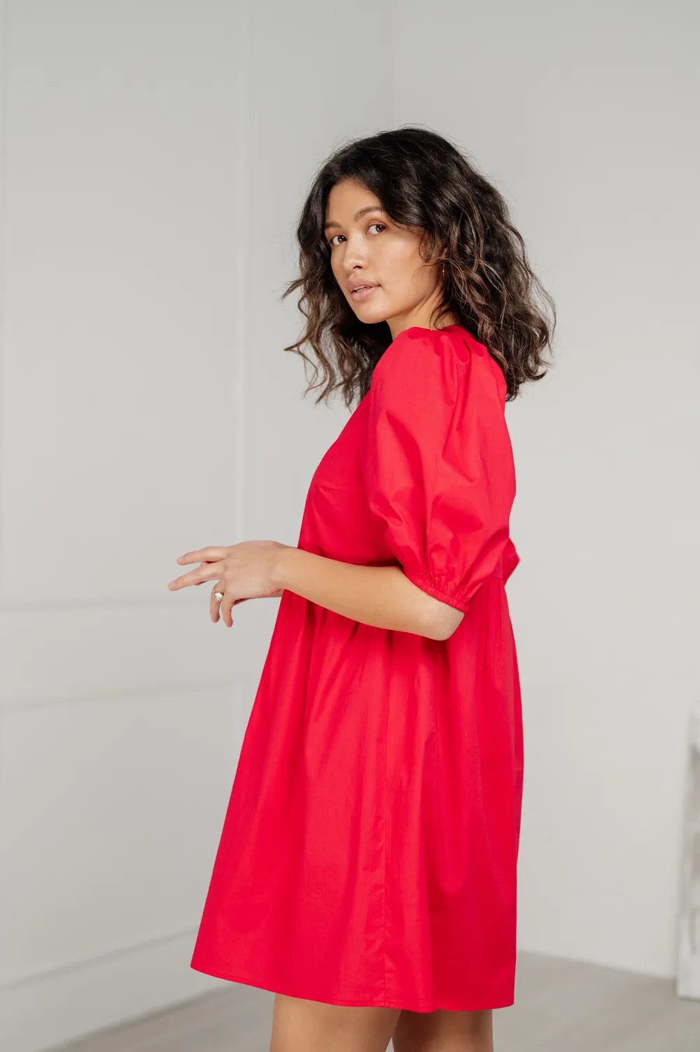 Red cotton mini dress with loose skirt.