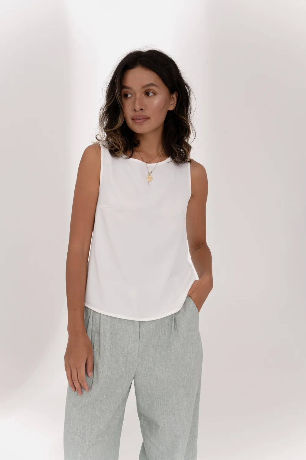 Milky sleeveless top with lace insert on the back