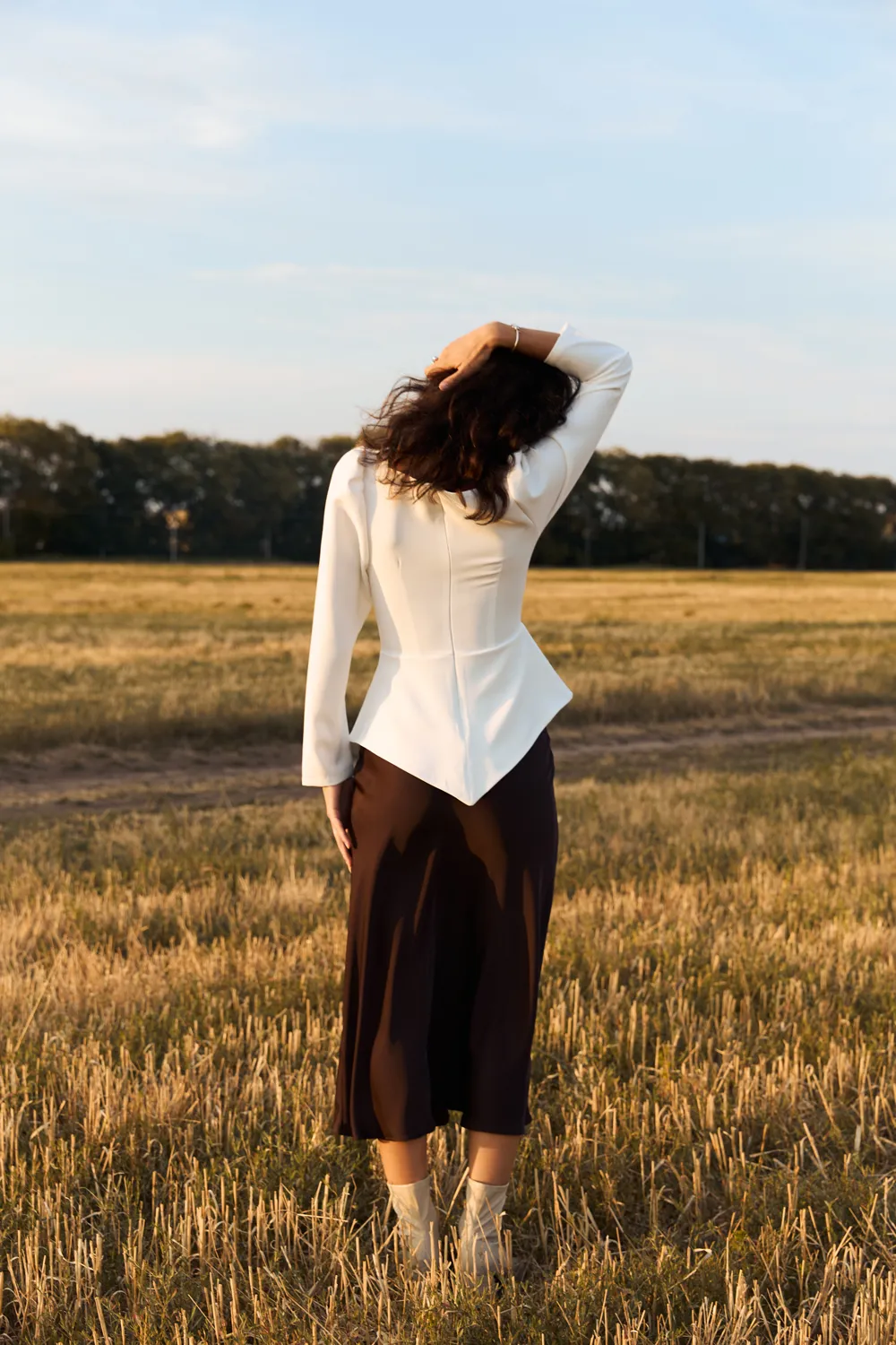 Milk blouse with a figured peplum